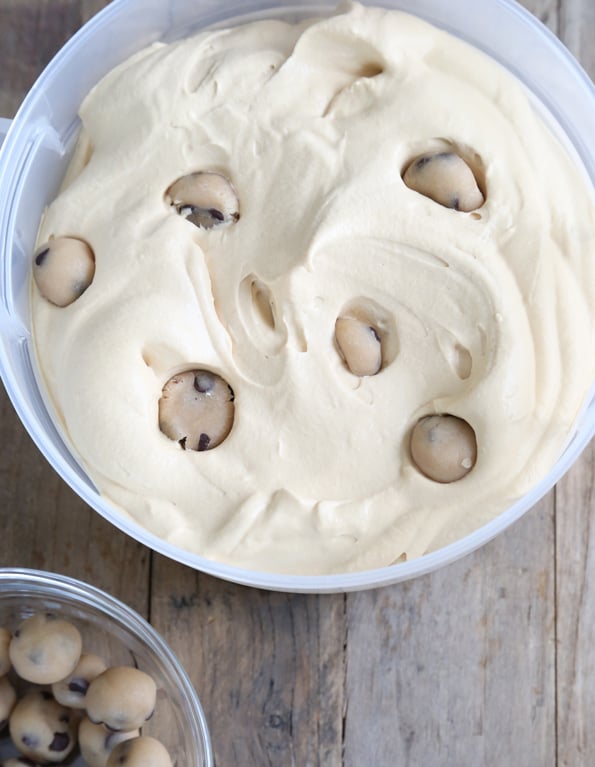 Chocolate Chip Cookie Dough Ice Cream in a large white tub