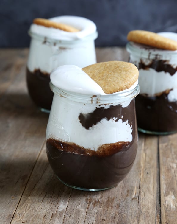 S\'mores Parfait with a cookie on top on white surface 