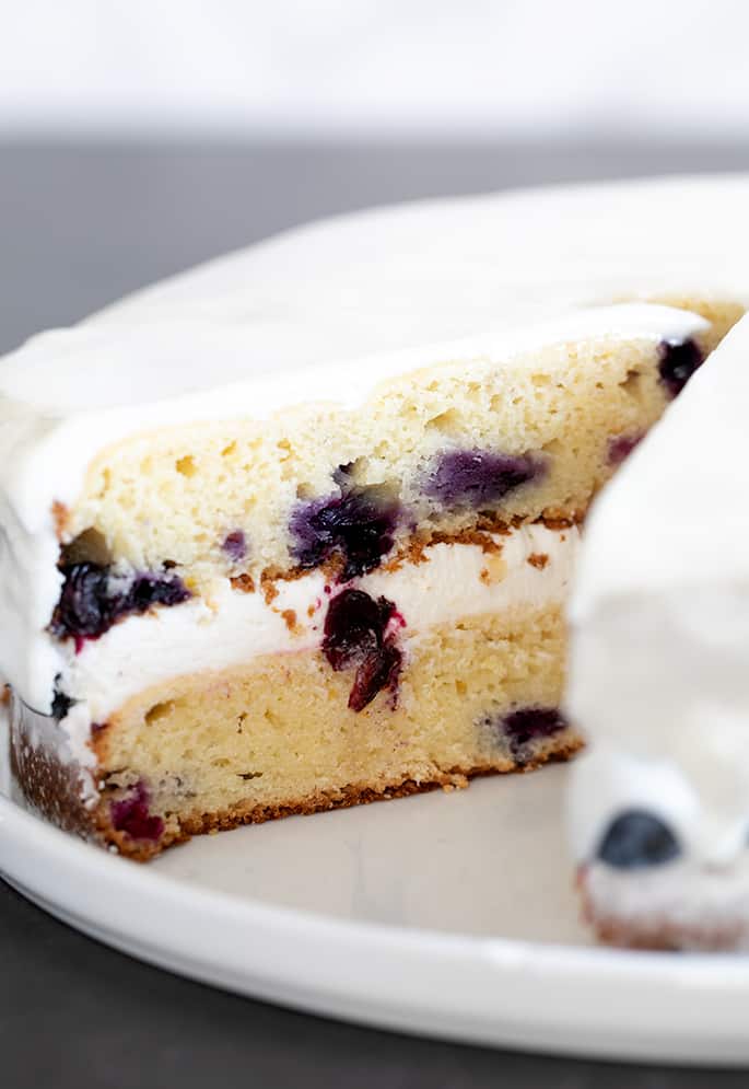 Gluten free lemon blueberry cake closeup on cake plate. 