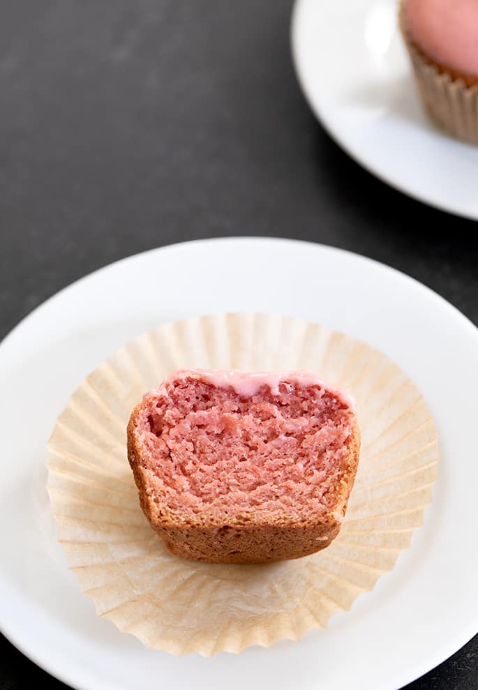 Strawberry cupcake on a plate cut in half