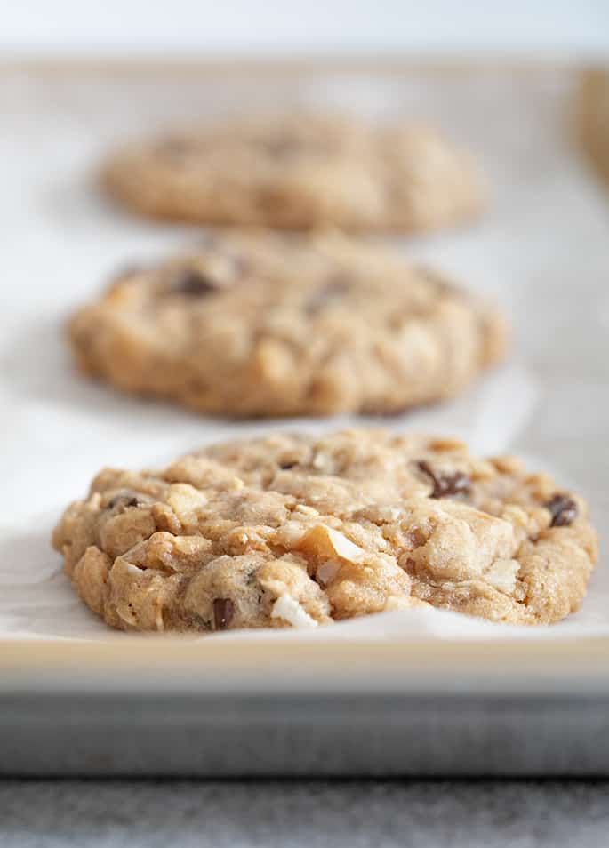 Closeup image of baked cowboy cookies on baking tray