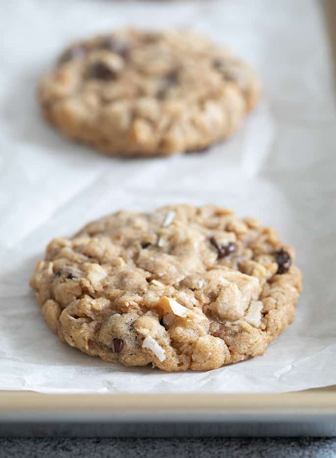 Cowboy cookies baked on white paper on tray