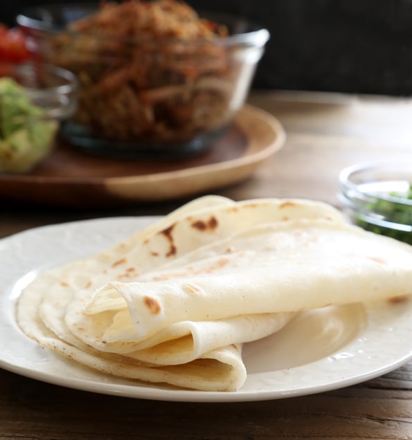 Tortillas on a white plate 