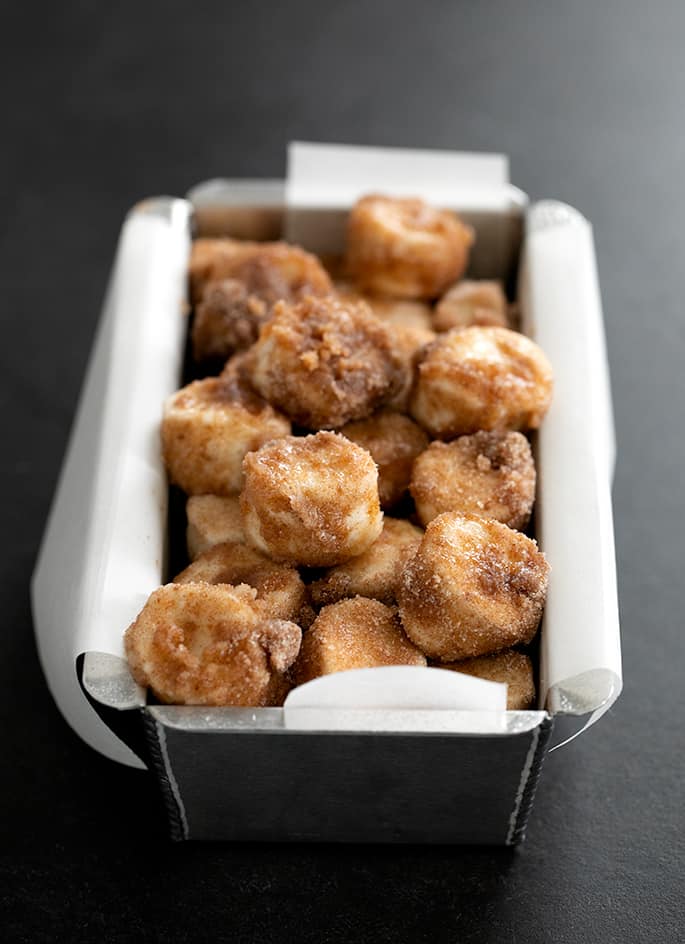 Gluten free monkey bread raw in loaf pan, ready to go in the oven.