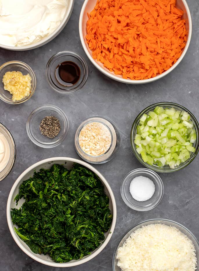 Spinach dip ingredients in small bowls