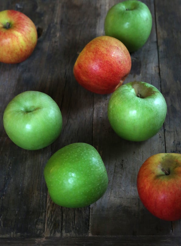 Apples on a wooden surface 