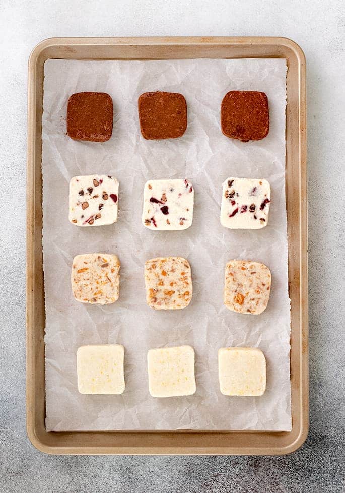 Shortbread cookies raw on tray image overhead 4 varieties