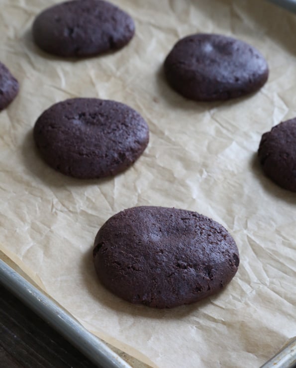 A close up of chocolate cheesecake cookies on brown surface 