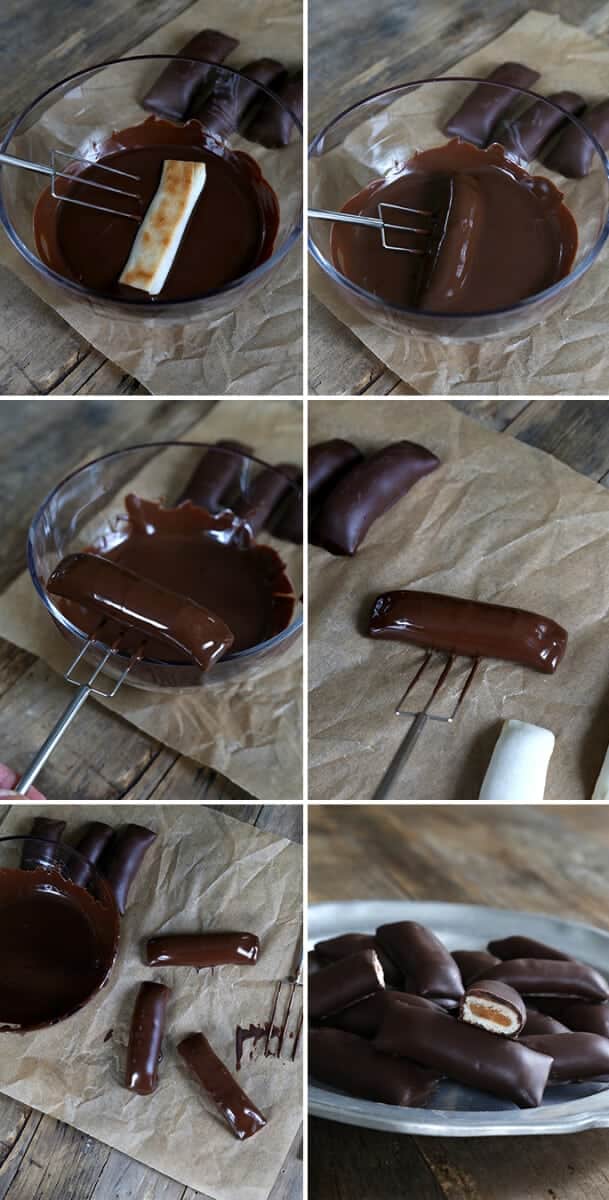 Peanut butter crunch bars being dipped in chocolate 