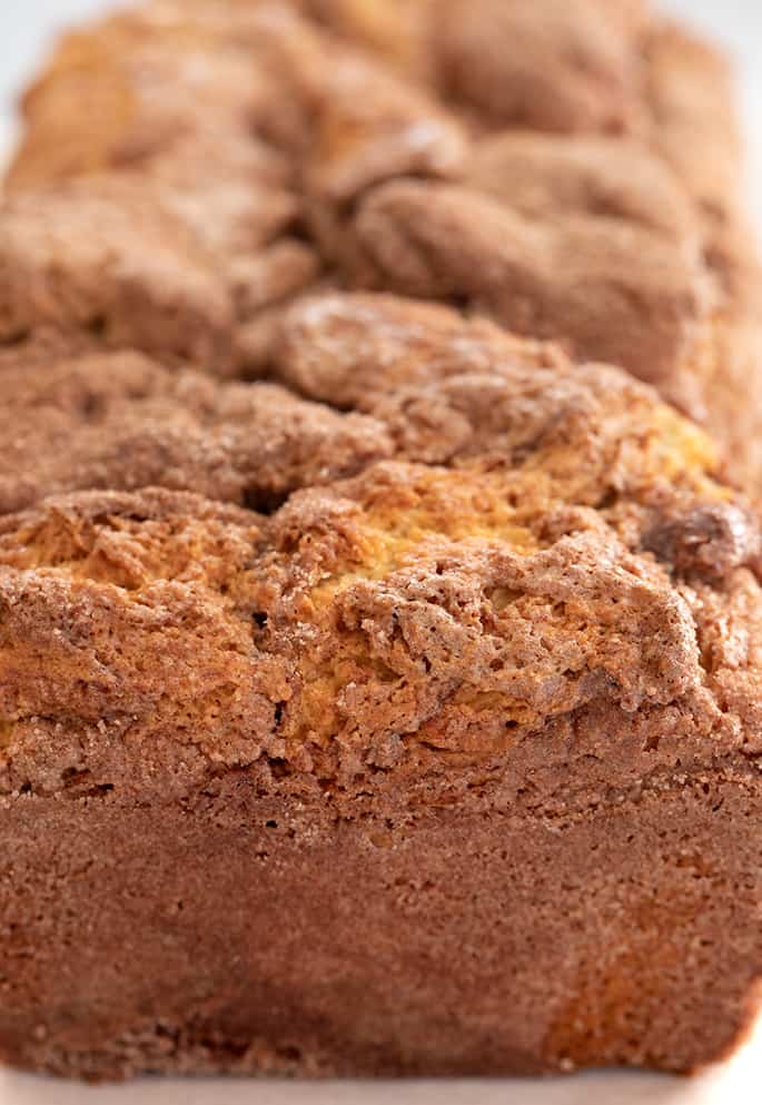 Whole baked loaf of cinnamon swirl closeup image