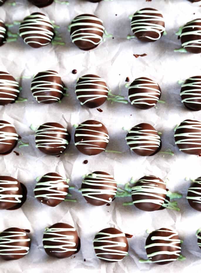 Overhead view of cookie dough truffles on white surface 