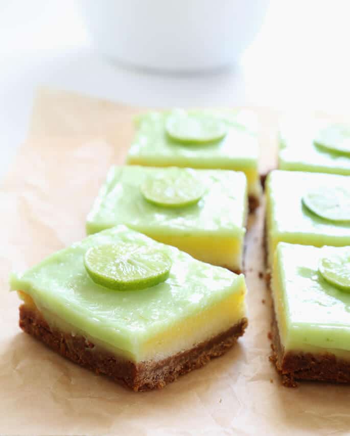 Key lime pie bars on parchment paper 