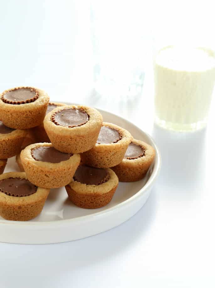 White plate with stacks of peanut butter cup cookies