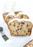 A few slices of glazed cannoli bread on a white surface