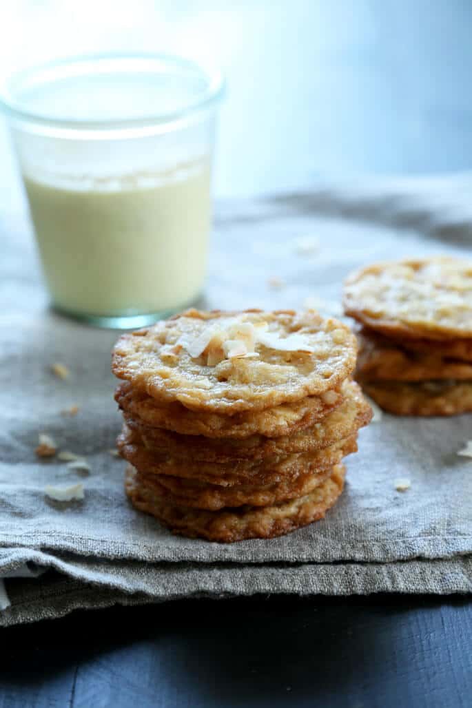 A stack of coconut cookies on a gray surface 