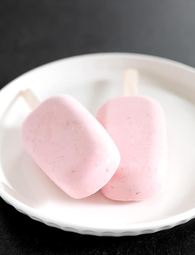 Strawberry Cheesecake Popsicles on plate