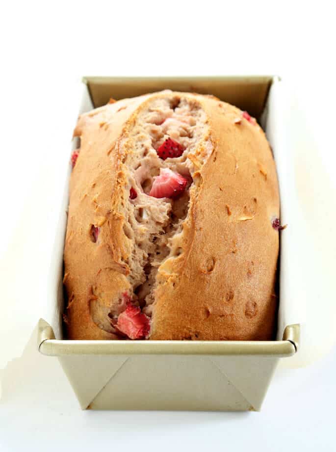 Close up of strawberry bread in a metal loaf pan