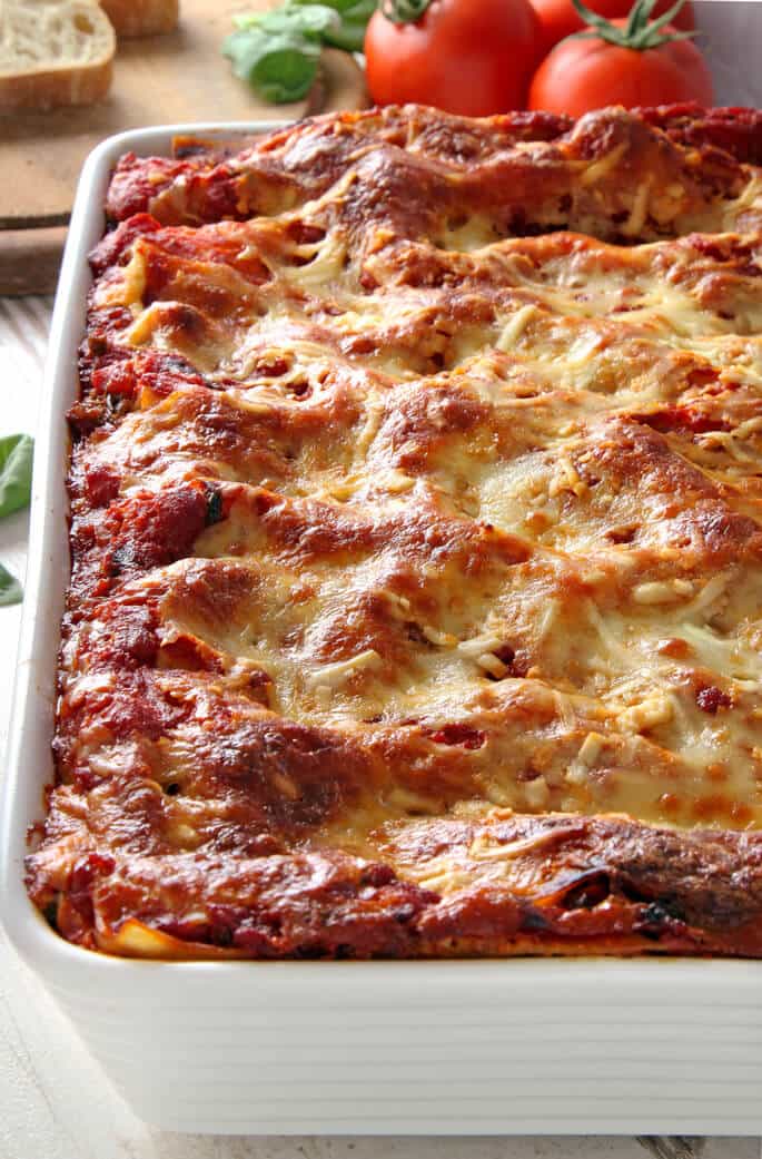 An overhead view of lasagna in a metal pan