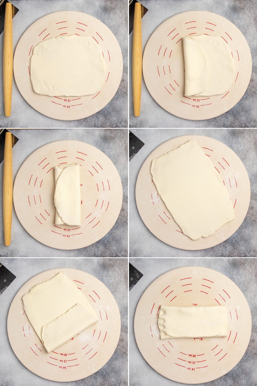 Light tan gluten free puff pastry dough rolled into a rectangle on light tan pastry board, folded in thirds, then rolled out again and folded in thirds again with 4 knuckle markings