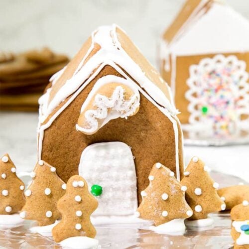 How to make a gluten free gingerbread house, the easy way. All you need are two different shapes of gingerbread cookies, and plenty of icing!