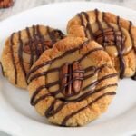 These grain free turtle cookies have all the taste of chocolate turtles in a neat little thumbprint cookie. Chocolate, caramel and pecans are a classic combination for good reason!