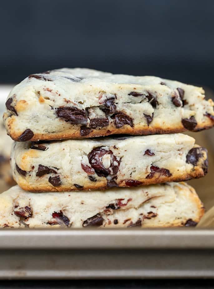 Three scones in a stack on a baking tray