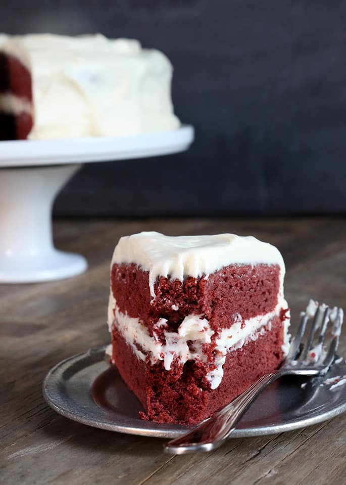 This classic gluten free red velvet cake is everything you remember red velvet to be. Moist and tender, lightly chocolate cake that is my go-to recipe whenever I want to please chocolate and non-chocolate lovers alike!