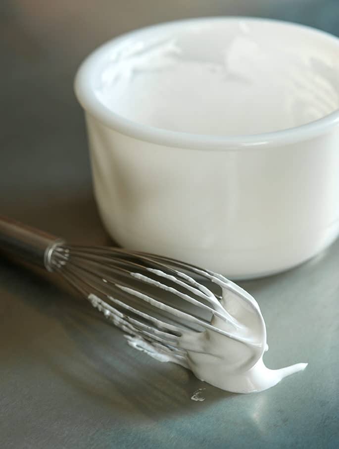 There are only 5 ingredients (including water!) in this simple recipe for homemade marshmallow creme, the soft, spreadable fluff that makes the best fudge, and even no churn ice cream!