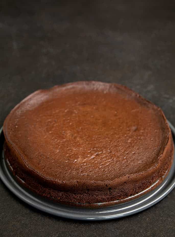 Whole flourless chocolate cake on springform pan bottom