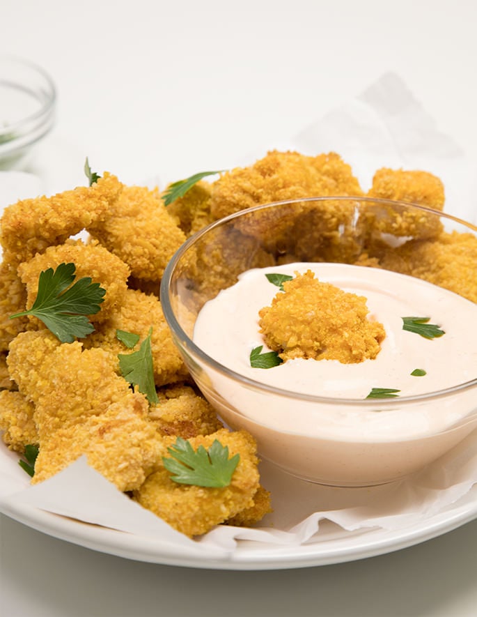 Popcorn chicken. Bite-sized pieces of breaded white meat chicken made extra tender with a secret, simple step, and baked to crispy perfection. 