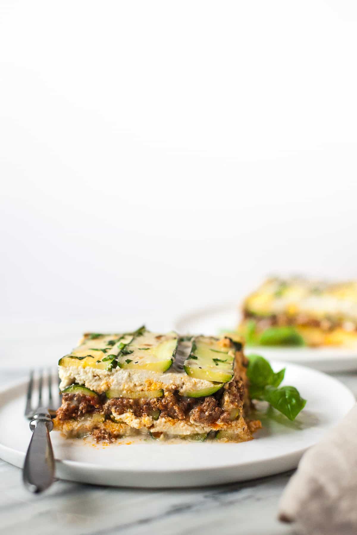 Craving Italian comfort food but avoiding grains and cheese? This Paleo zucchini lasagna is for you. 