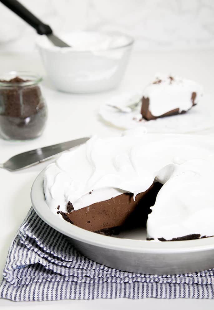 This chocolate pudding pie is my favorite no bake gluten free treat of the season. The filling is smooth as silk, plus the cookie crust slices clean, and adds just the right amount of cookie crunch.