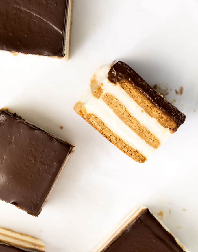 A no bake chocolate eclair cake made with graham crackers, whipped vanilla pudding and covered in chocolate ganache. 