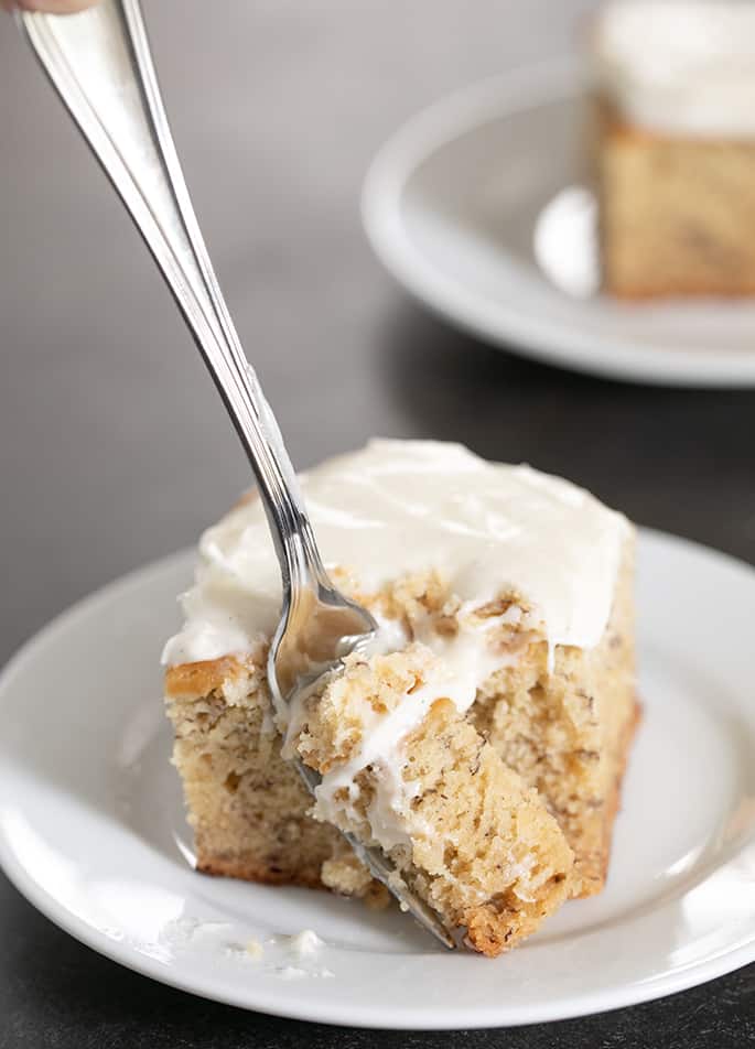 Forkful of banana cake with frosting