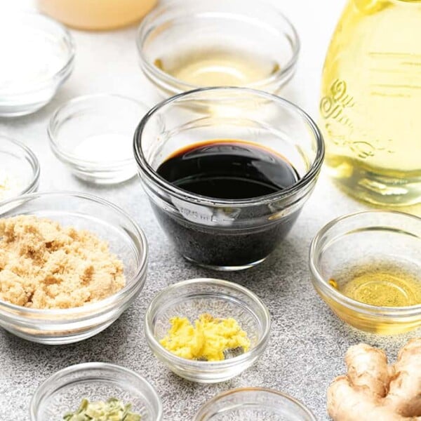 Different sizes of small glass bowls with ingredients for lomein sauce