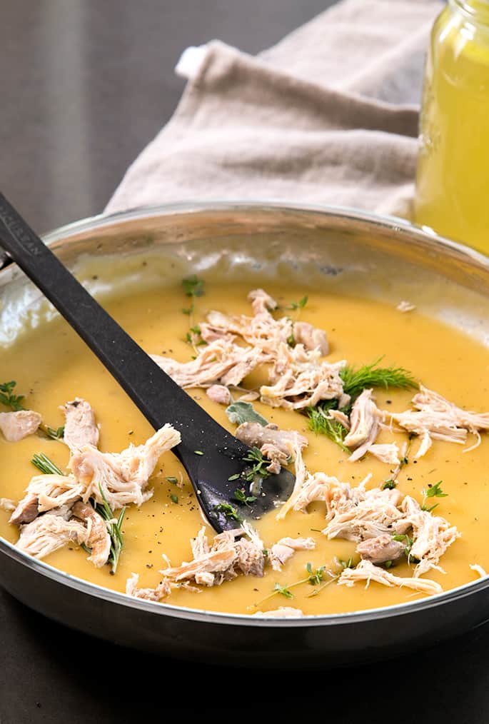 This condensed chicken and vegetable soup is packed with flavor and can be made up to a week ahead of time. Just add more stock and dinner is served!