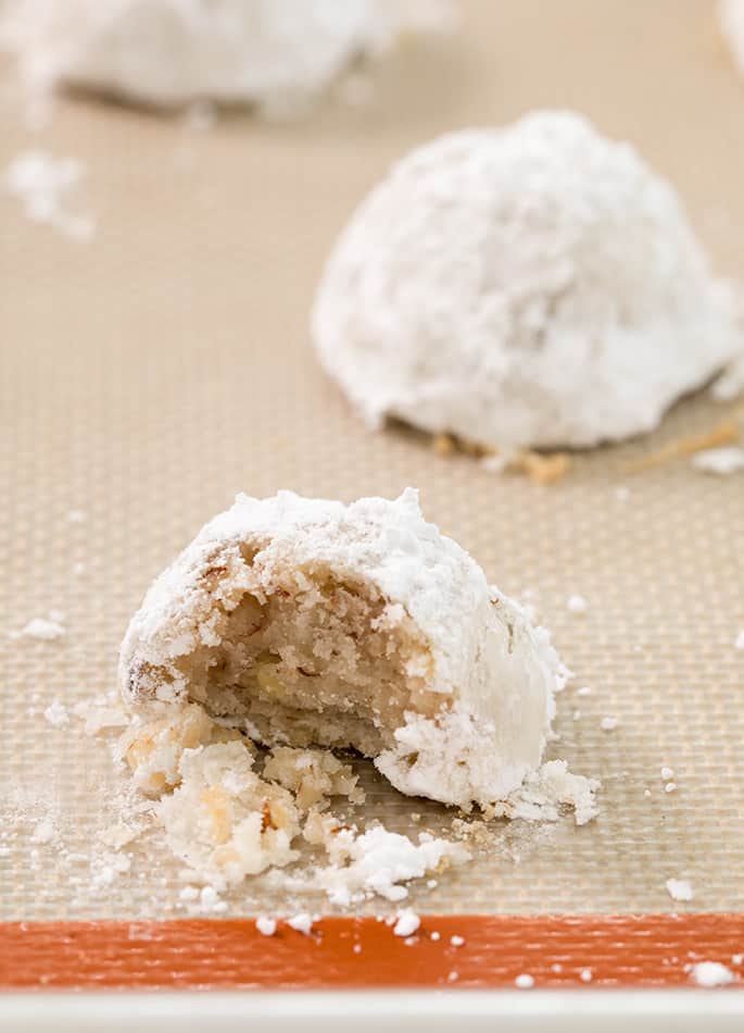 These gluten free snowball cookies, also known as Russian tea cakes and Mexican wedding cookies are super tender butter cookies, made with chopped nuts and always covered in powdered sugar.