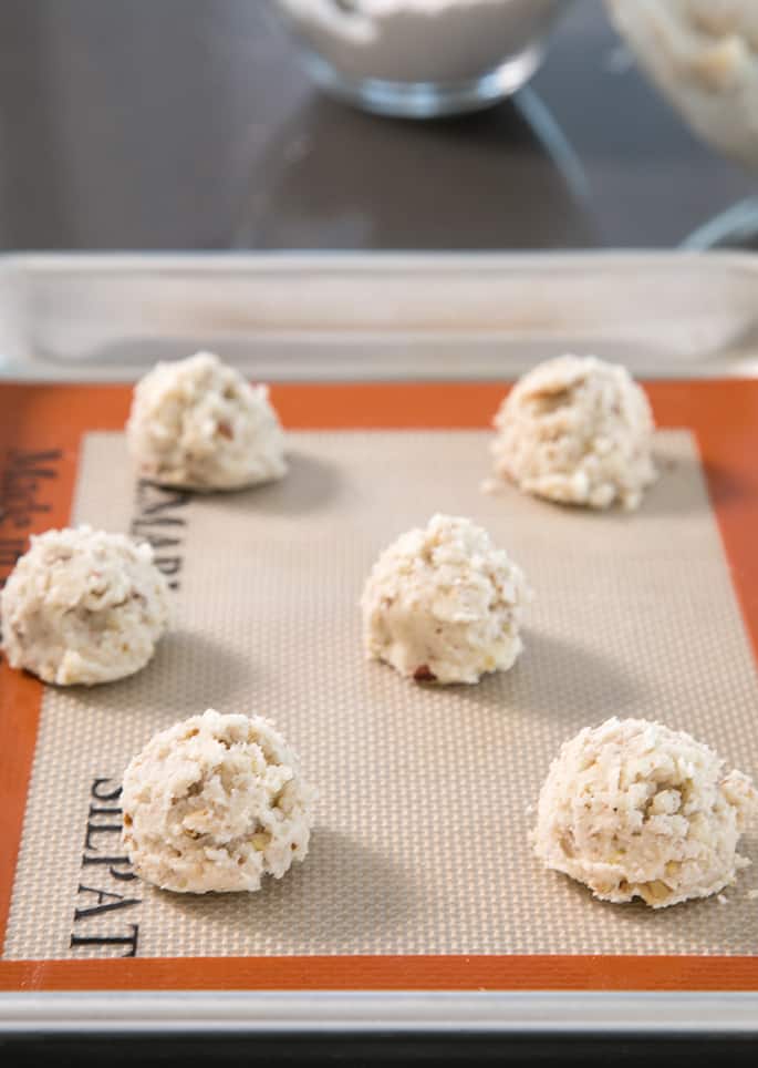 These gluten free snowball cookies, also known as Russian tea cakes and Mexican wedding cookies are super tender butter cookies, made with chopped nuts and always covered in powdered sugar.