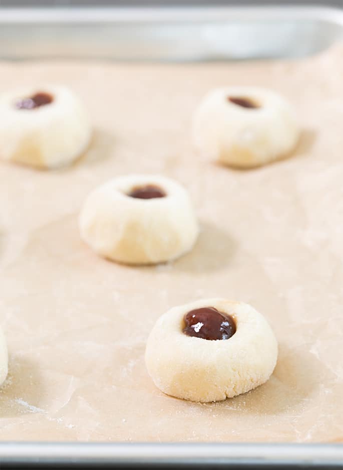 These easy jam thumbprint cookies are simple butter cookies made with flour, sugar, butter and egg yolks—and a dollop of jam on top. The best cookies are often the simplest ones!