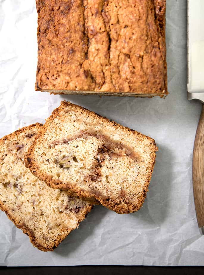 This cinnamon swirl gluten free banana bread is naturally dairy free—and it's incredibly moist and tender. The cinnamon-sugar just seals the deal. It's going to become your new favorite way to save those dying bananas!