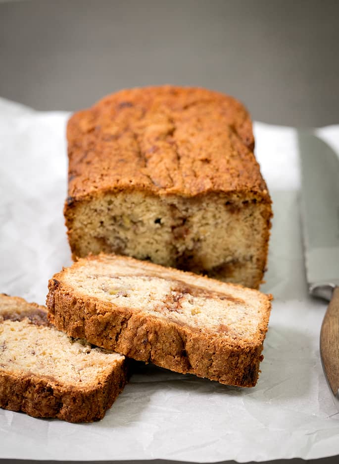 This cinnamon swirl gluten free banana bread is naturally dairy free—and it's incredibly moist and tender. The cinnamon-sugar just seals the deal. It's going to become your new favorite way to save those dying bananas!