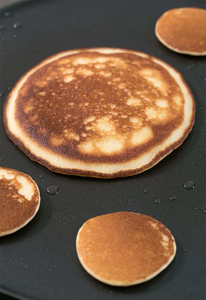 These lightly sweet Paleo pancakes are made with almond flour, so they're naturally low carb and actually taste like "real" pancakes. Enjoy them with maple syrup, or plain. And make your own Paleo baking powder easily for fluffy pancakes!