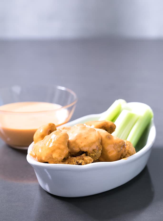  This easy recipe for buffalo cauliflower bites is made in the Air Fryer for a low-calorie, Paleo-friendly appetizer or side dish. Naturally gluten free and dairy-free, too!