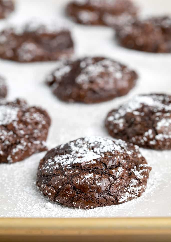 Closeup image of flourless chocolate cookie on baking sheet