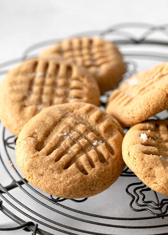 Closeup image of flourless peanut butter cookie on rack