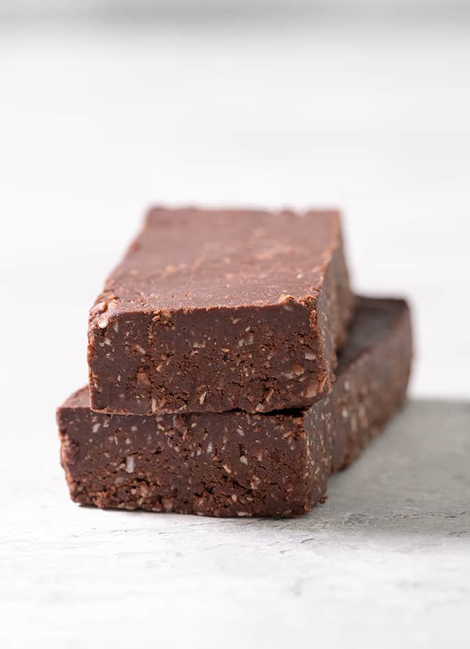 Brown rectangular protein bars made with coconut chips as a substitute for oats