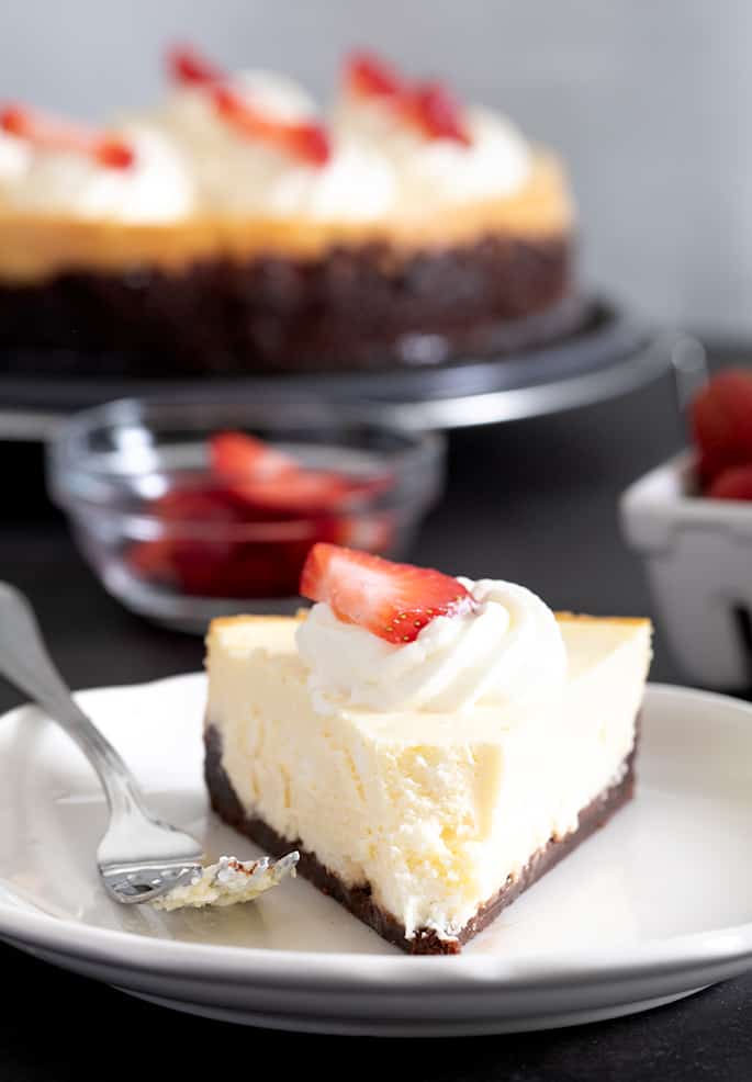 This easy classic gluten free cheesecake is made simply with cream cheese, sugar, and eggs. With or without a graham cracker crust.