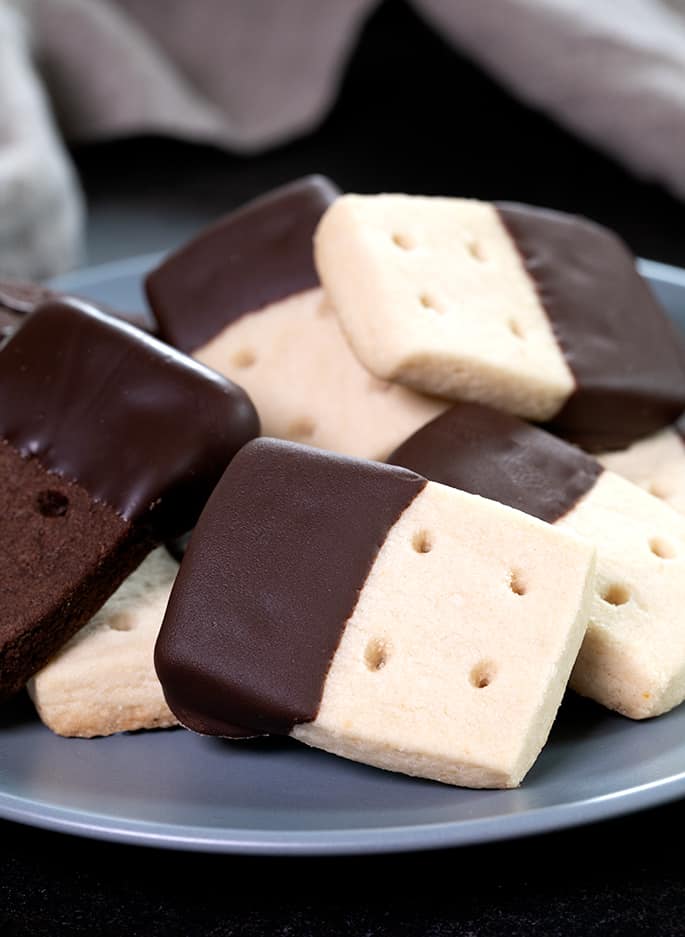 These gluten free brown sugar shortbread cookies are made with little more than butter, brown sugar and flour, hold their shape, and are anything but plain!