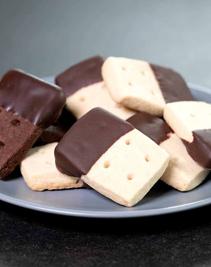 These gluten free brown sugar shortbread cookies are made with little more than butter, brown sugar and flour, hold their shape, and are anything but plain!