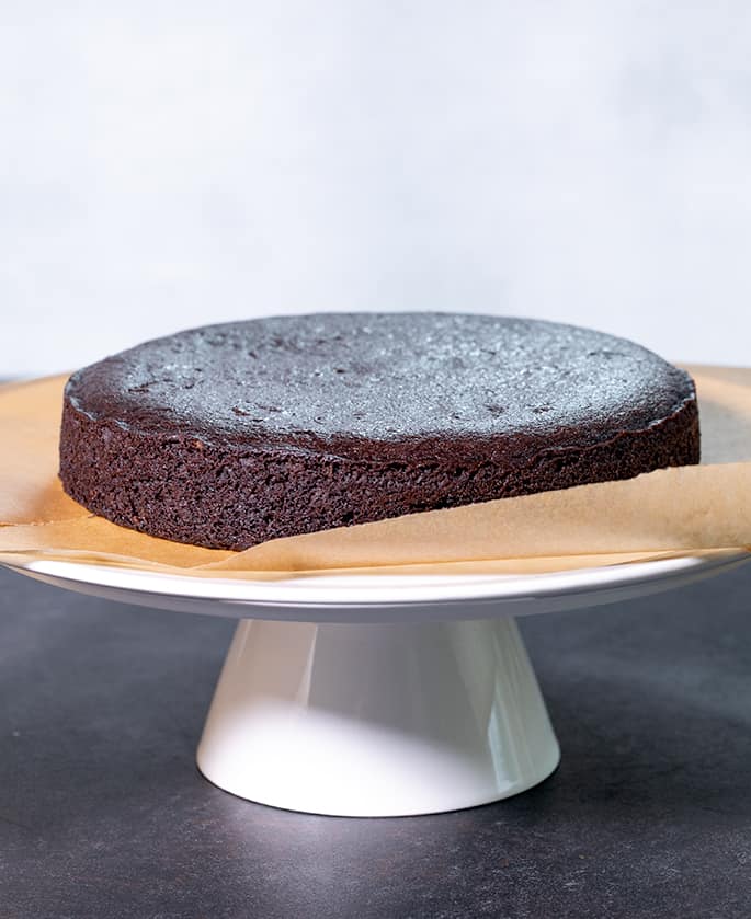 This crazy cake is a gluten free chocolate cake made with no eggs, no butter and no chopped chocolate—but it's still super moist and tender.